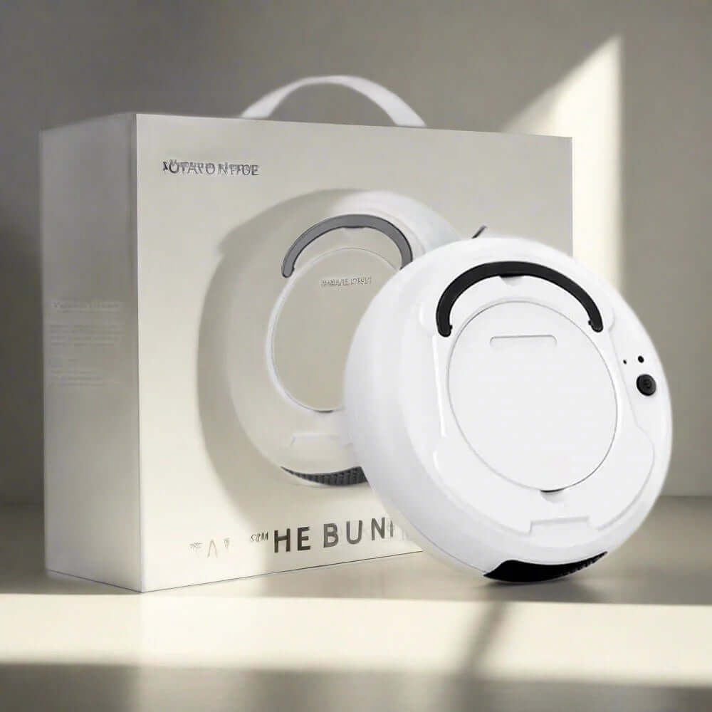 White robotic vacuum cleaner and packaging on a kitchen counter in natural light