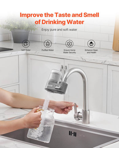 Faucet water filter attached to kitchen tap with filtered water pouring into a glass jar