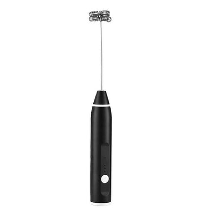 Black handheld milk frother for coffee and kitchen drinks on white background