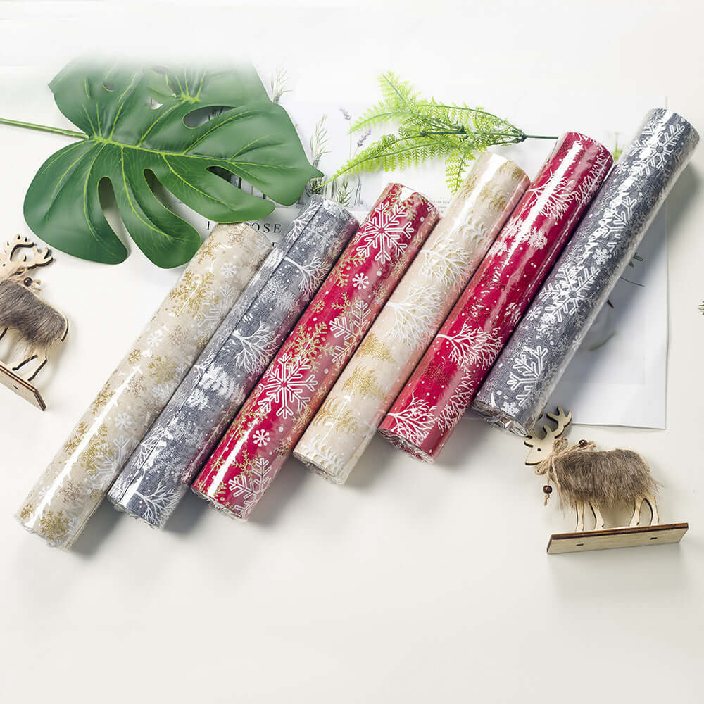 Assorted Christmas-themed kitchen drawer liners with festive snowflake patterns, flat lay.