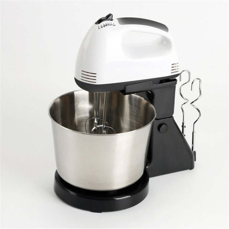 Electric stand mixer with stainless steel mixing bowl and beaters on a white background