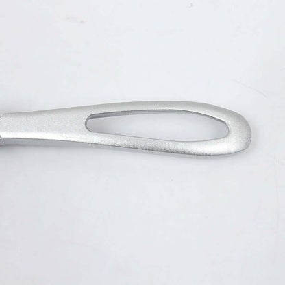 Metal kitchen utensil handle with ergonomic open-loop design on white background
