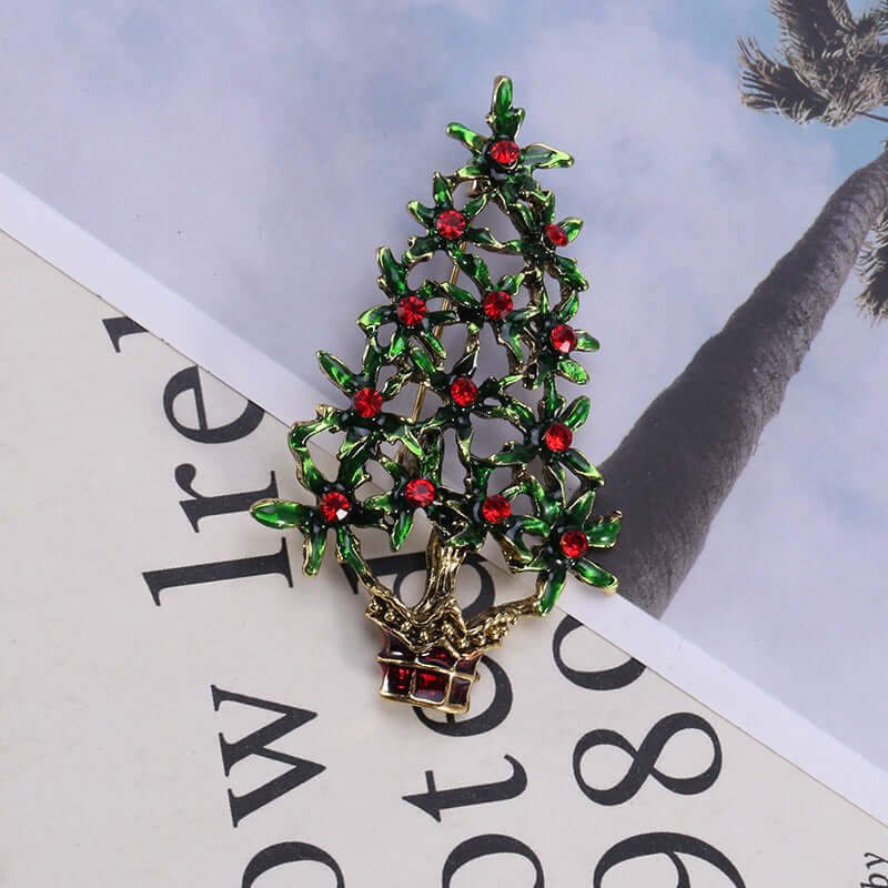 Christmas tree brooch with green leaves and red gemstones, decorative gift accessory