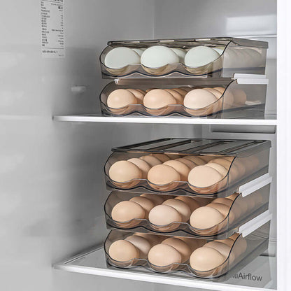 Stacked clear plastic egg storage containers filled with eggs in a refrigerator.