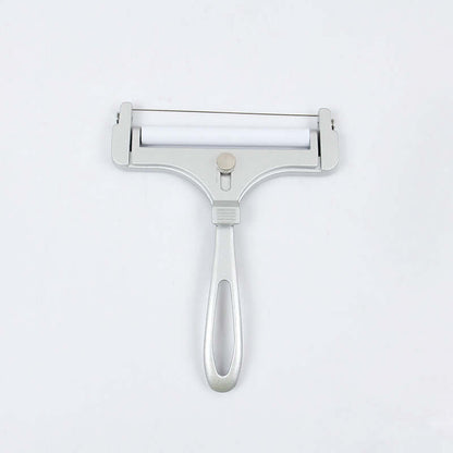 Stainless steel adjustable cheese slicer kitchen tool on white background