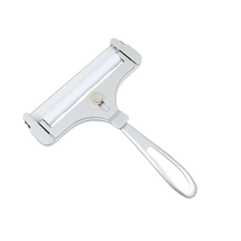 Stainless steel adjustable cheese slicer with ergonomic handle on white background