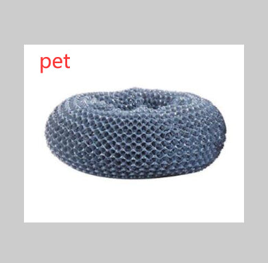 Round gray mesh kitchen scrubber with textured surface, isolated on white background